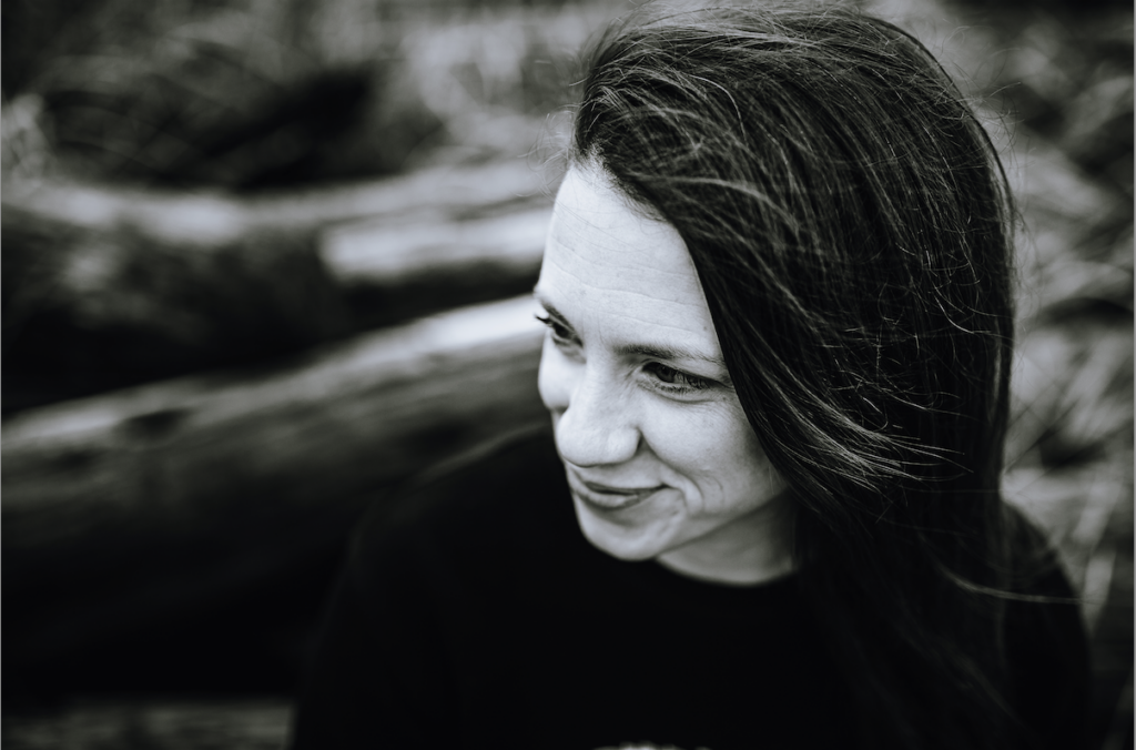 Black and White headshot of Tiffany looking to the side. She offers custom web design on Vancouver Island.